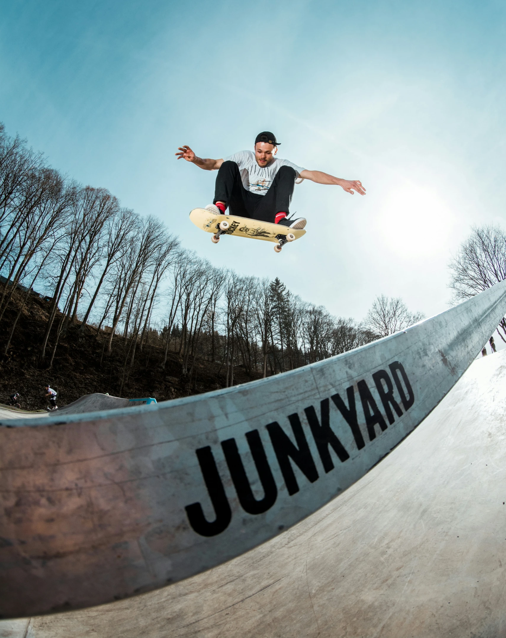 a person on a skate board does tricks at the park