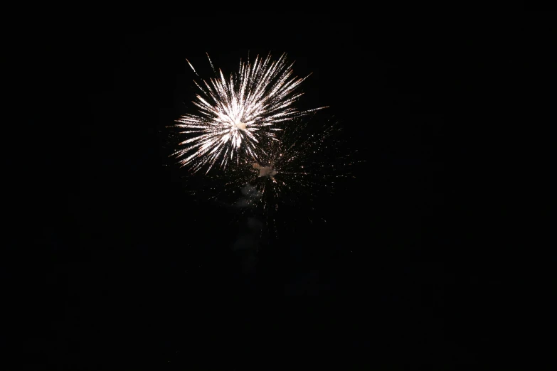 fireworks with large black background in the night sky