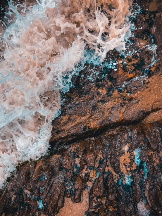 this is an aerial pograph of some water near a beach