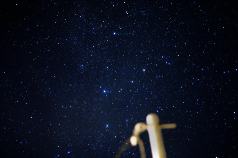 night sky with stars and telescope at end of walk way