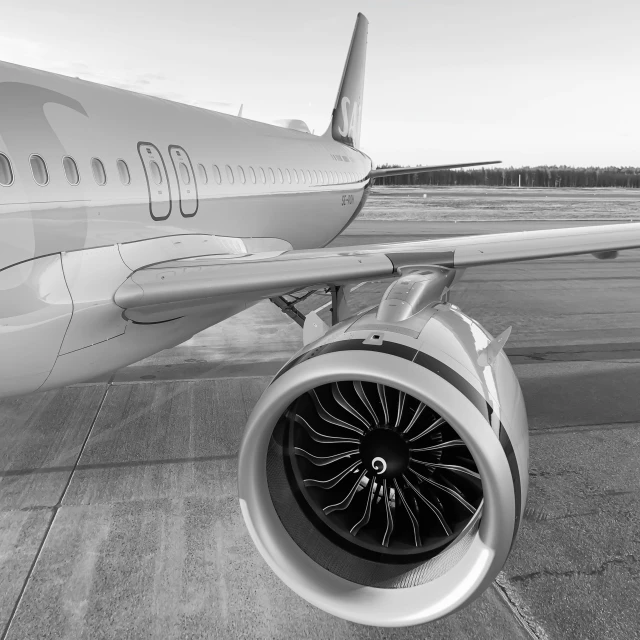 a jet engine is attached to the wing of an airplane