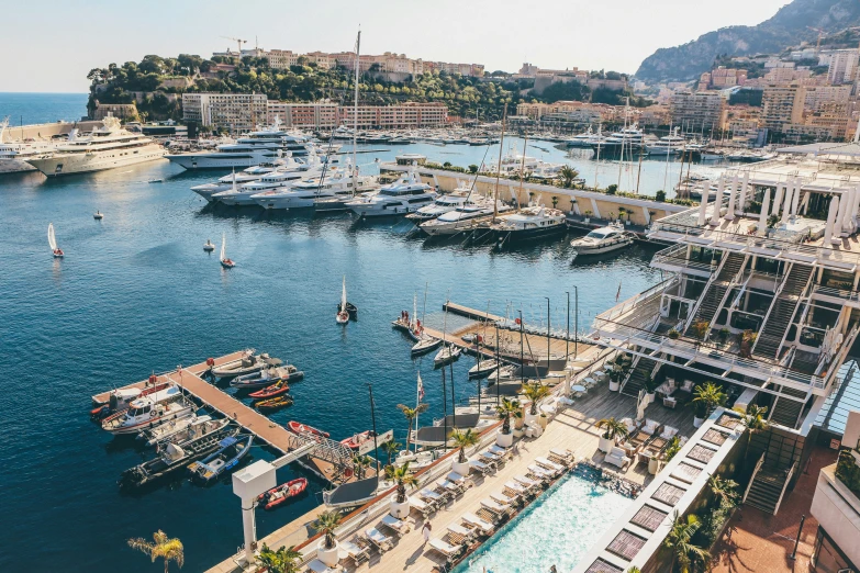 a harbor filled with boats next to a shoreline