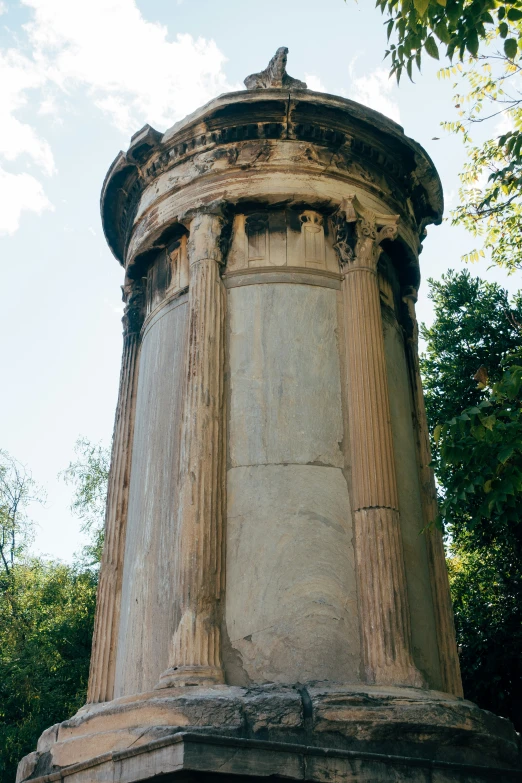 an old round structure has roman columns and carvings