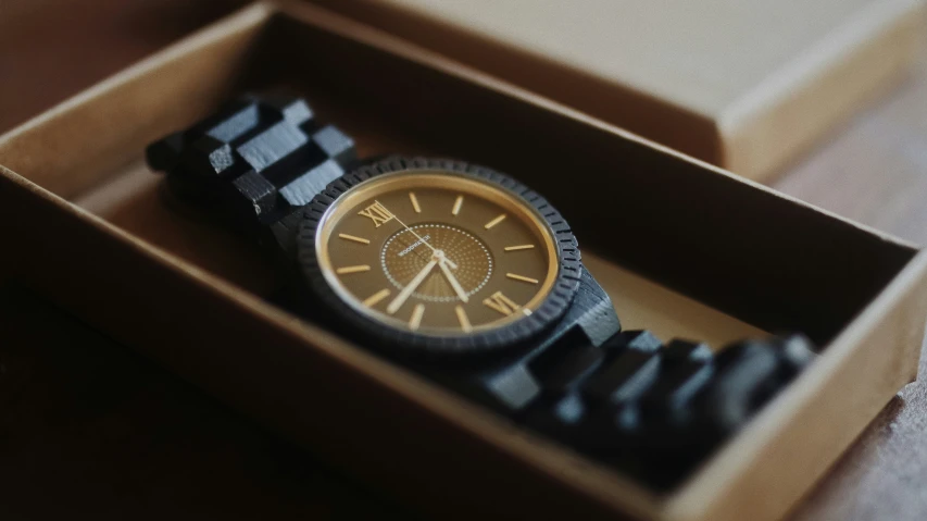 a wooden watch with a metal case