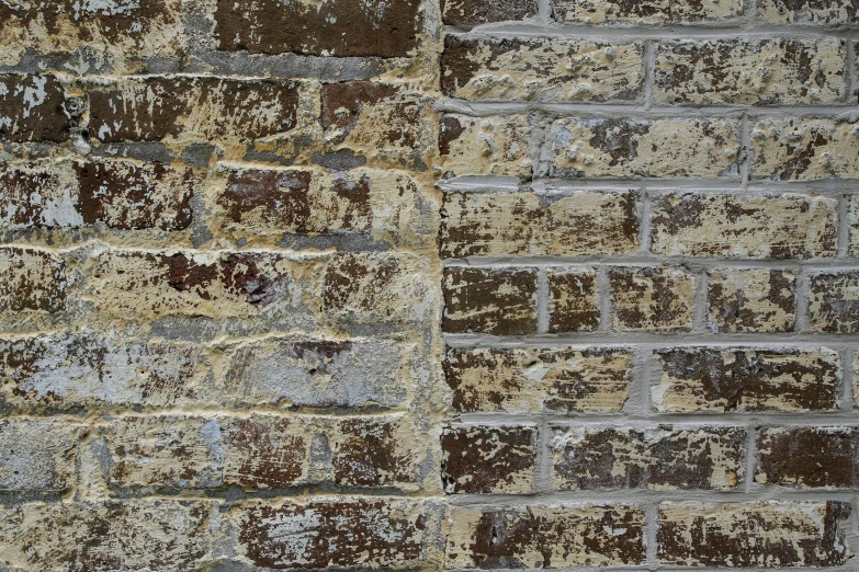 a worn and worn wall, with paint chipped in the middle