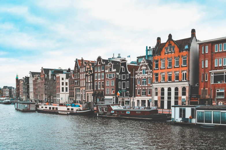 a canal with boats and old buildings along side it