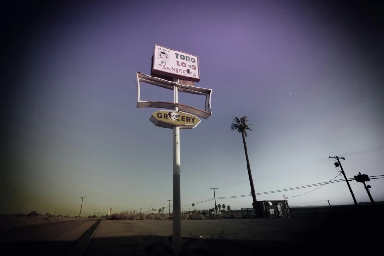 a street sign with a very big sign on it