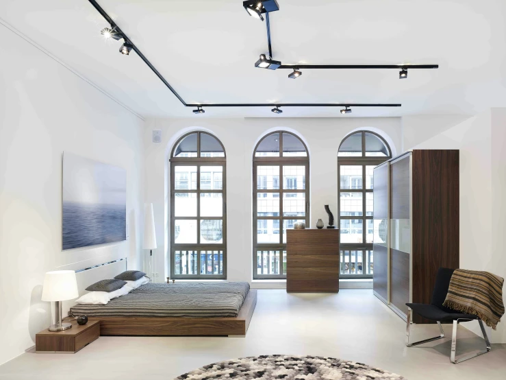 an empty and modern bedroom with two big windows