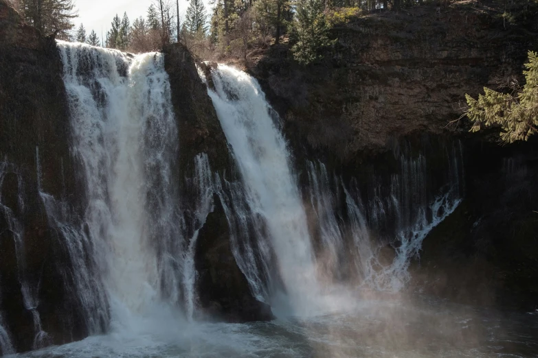 a waterfall with several waterfalls that are very tall