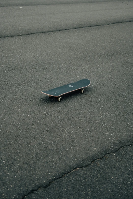 a skateboard is laying down on the road