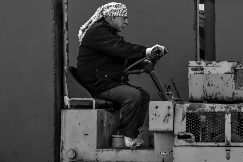 a black and white po of a person riding on a truck