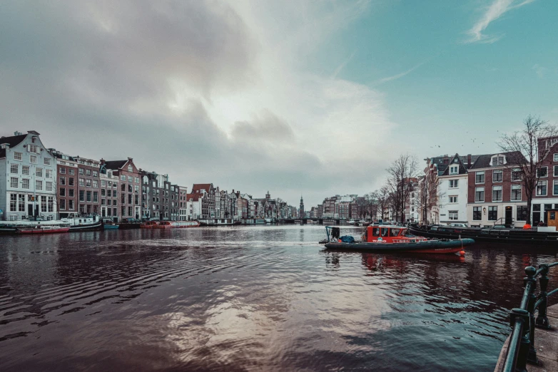 two boats docked at the end of a canal