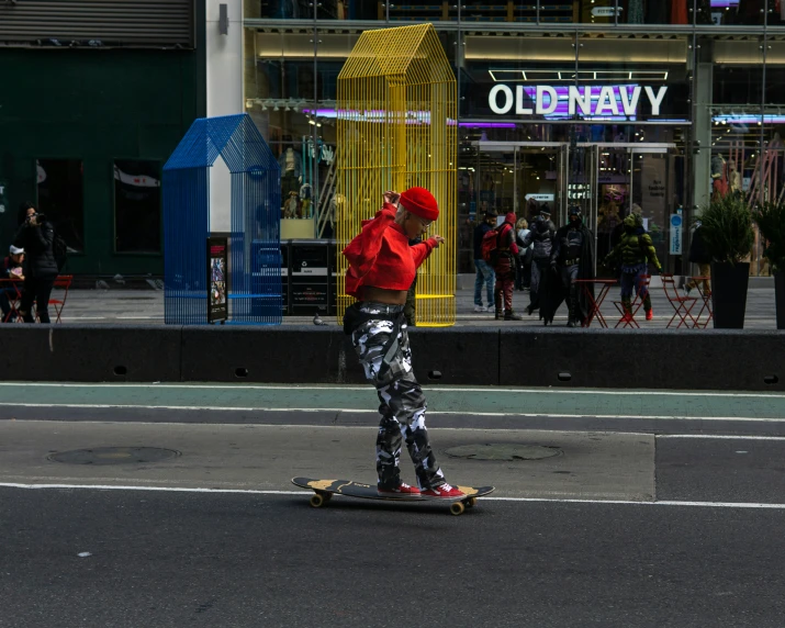 a person riding a skateboard down a city street