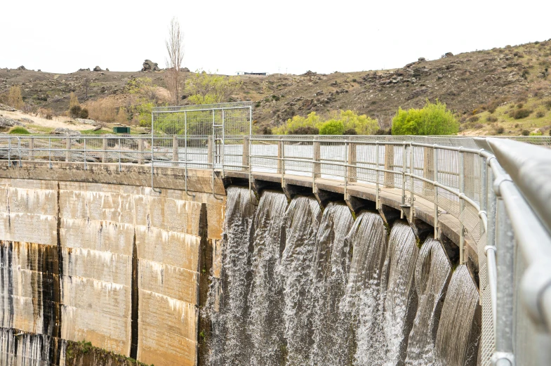 the large wall of water has a wire at its side