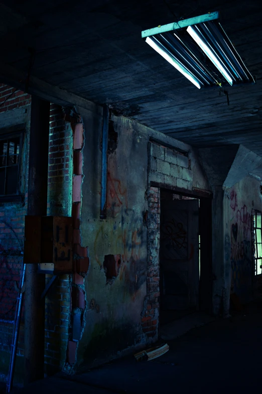 the ceiling in this dark room has graffiti