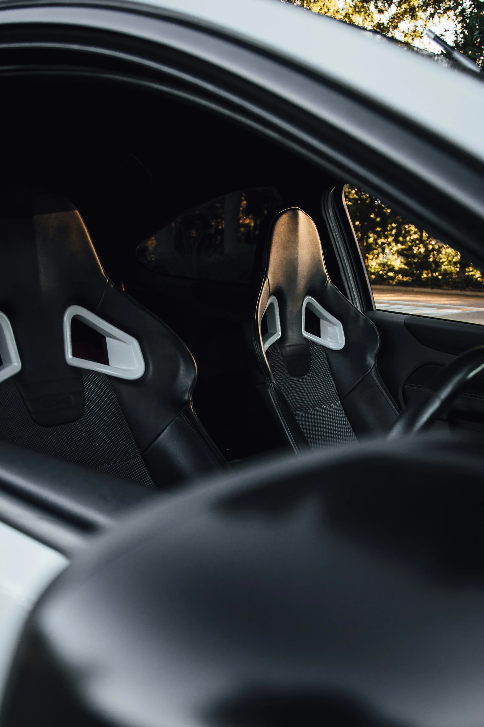 close up of a car door with a black seat