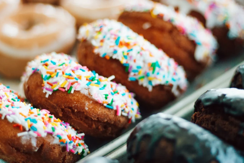 a plate filled with donuts and sprinkles