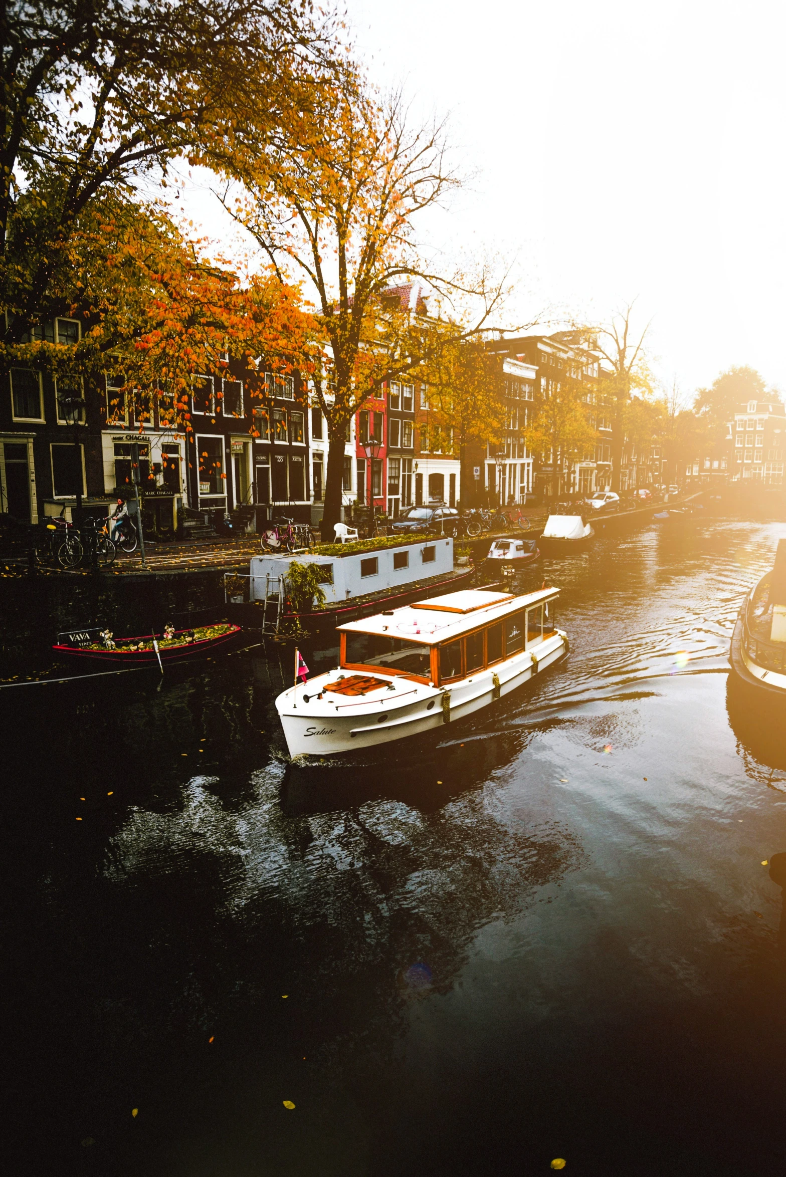 two boats are sitting on the canal