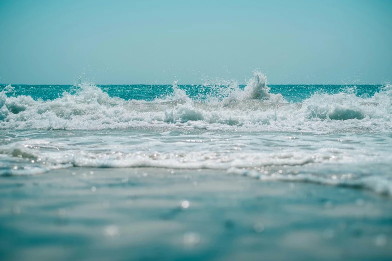 water splashing and a man surfing on the waves