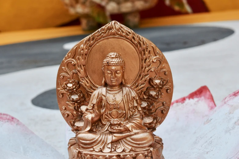 buddha statue on display near decorations in oriental environment