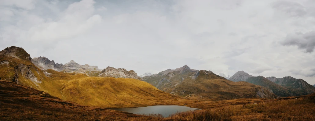 the mountains have snow on them along with water in them