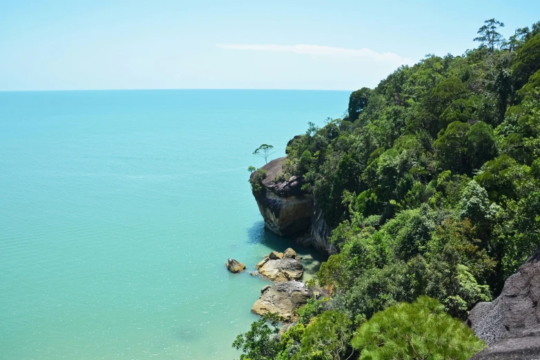 a view of the ocean and rocks out in the water