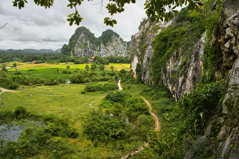 a mountain valley in the middle of a lush green landscape