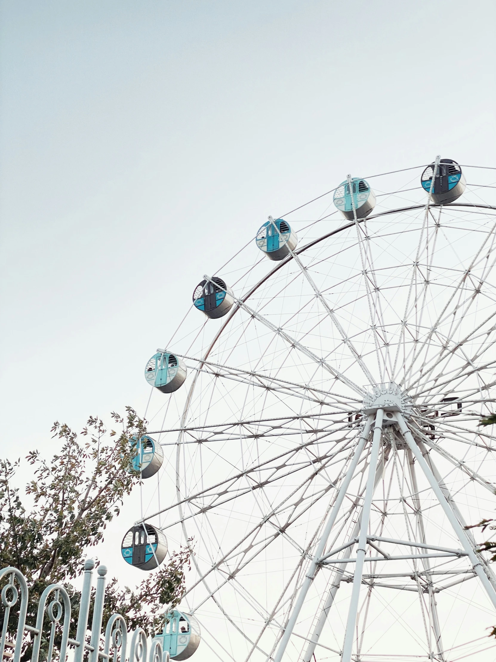 the ferris wheel is empty of any passengers on board