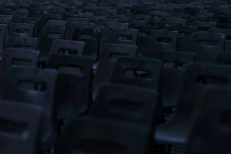 rows of empty chairs sit in an arena