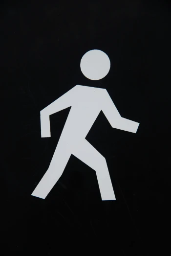 a white man walk sign on a black background