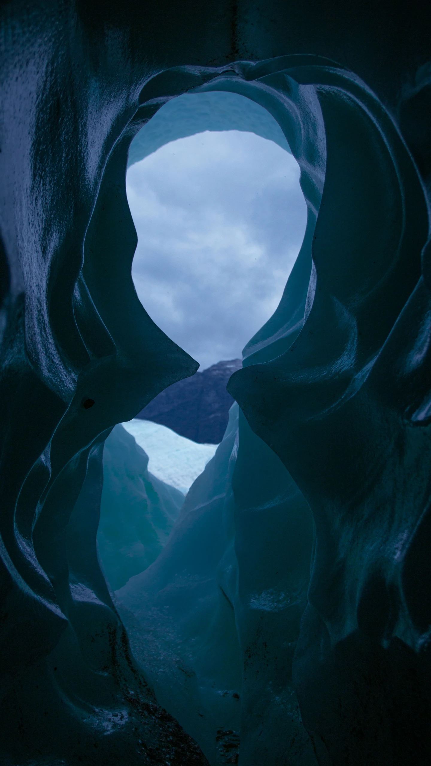 a large body of water is seen from a rock