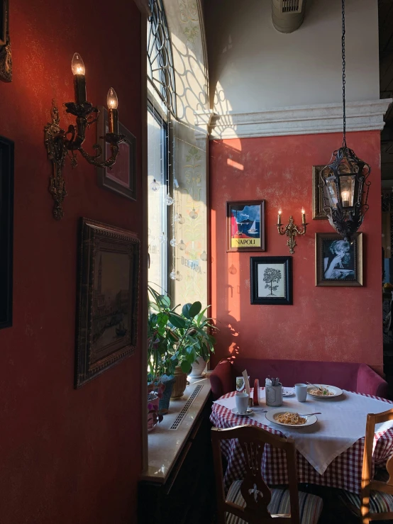 a small table next to an open door with chairs in it