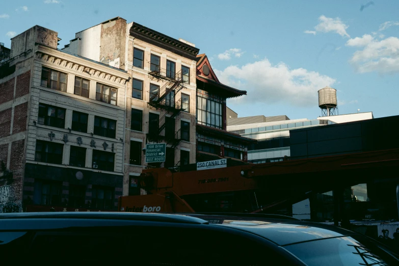 a building with balconies and a water tower