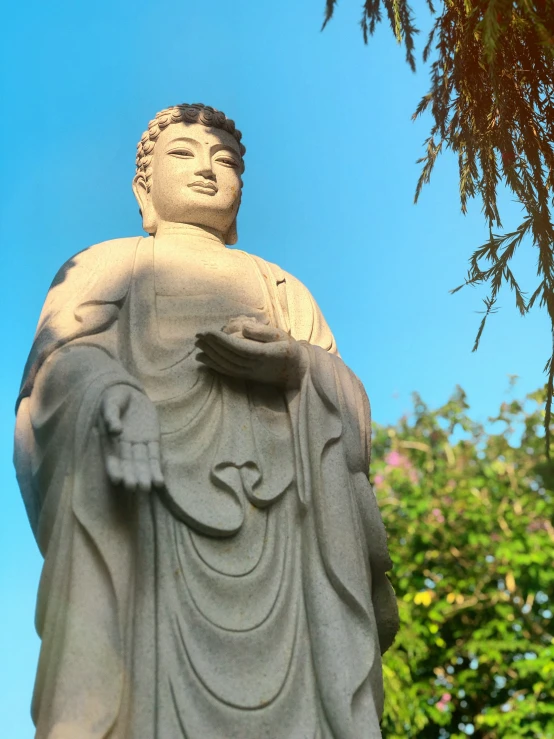 a close up of a statue with trees in the background