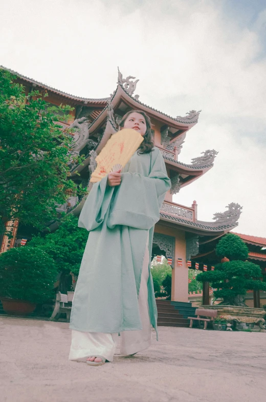 a woman is posing with an open umbrella