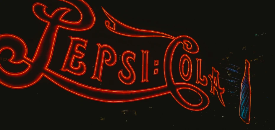 a lighted sign with some writing on it