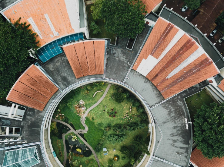 a circular building in a city with lots of buildings