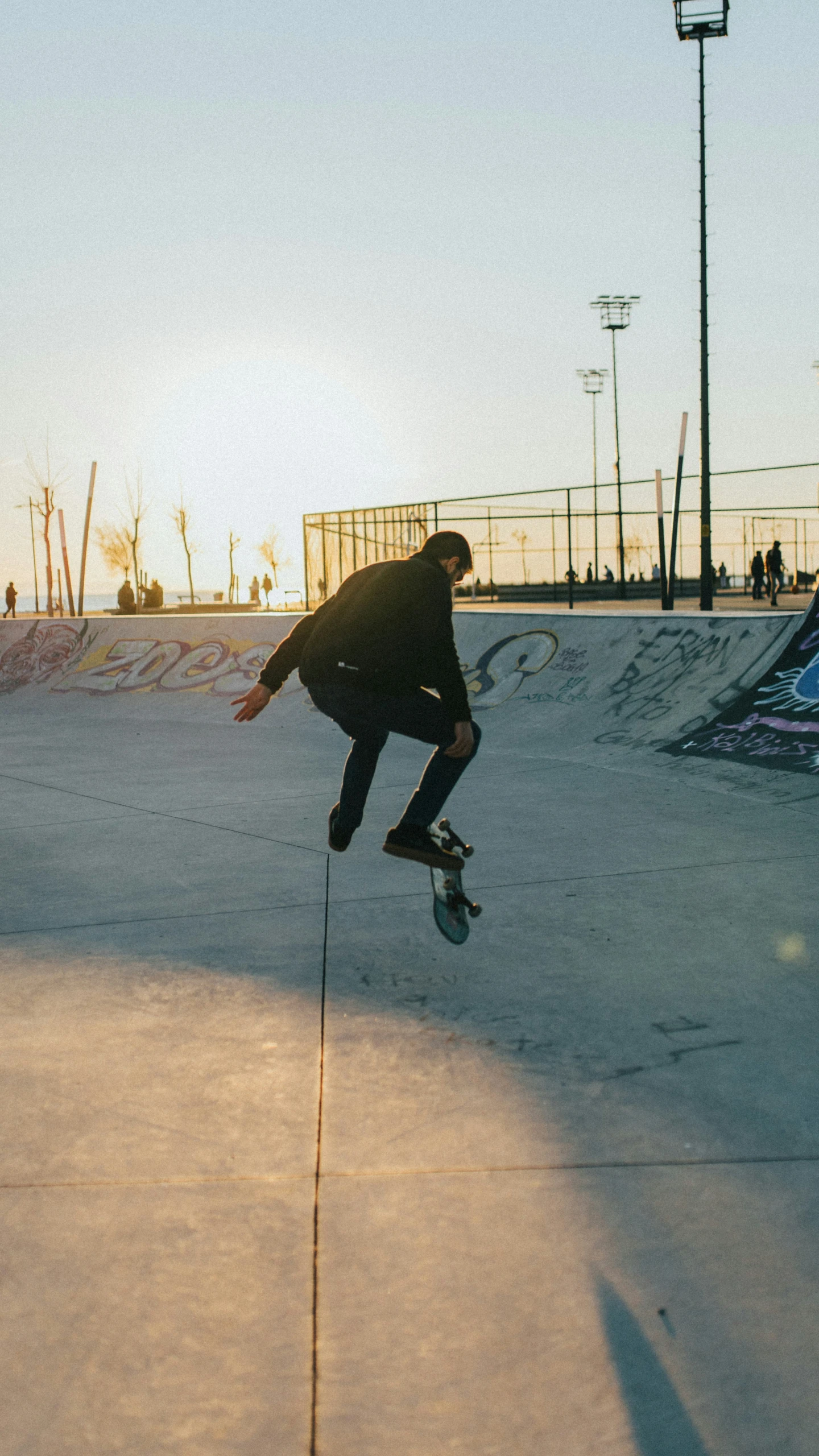 a young man in the air as he rides a skateboard