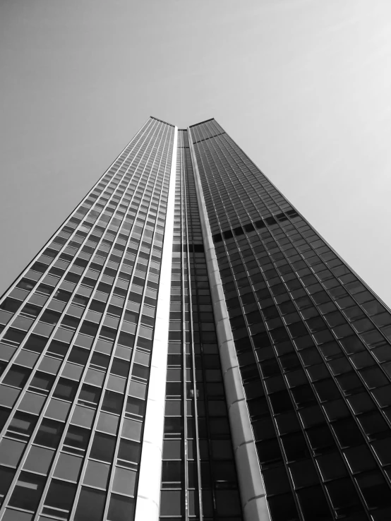 tall buildings against the sky in black and white