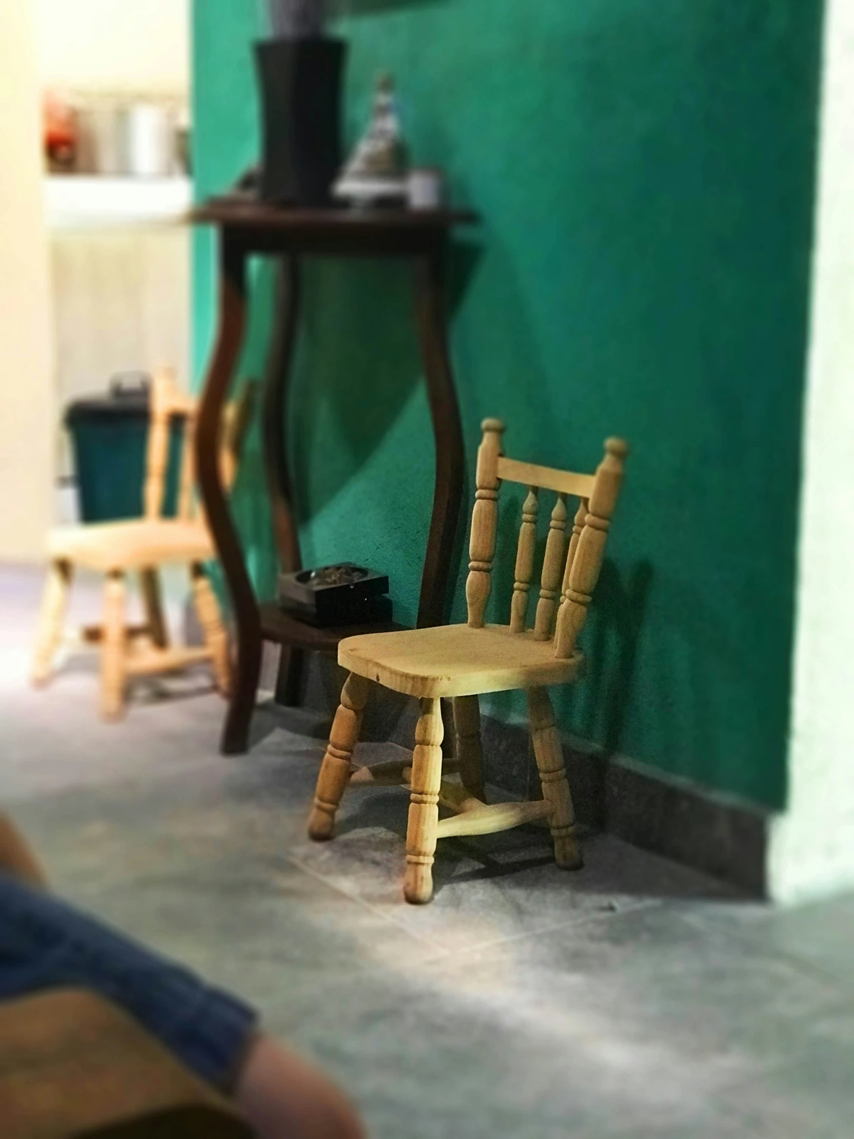 a miniature chair and table on a floor