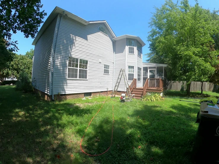 there is a large yard with two houses