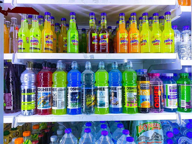 bottles of various color on shelves at a store