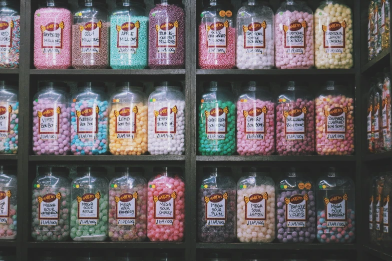 various bottles of different kinds and flavors in the shelf