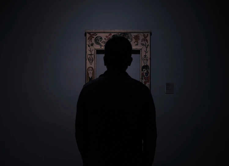a man standing in a dark room