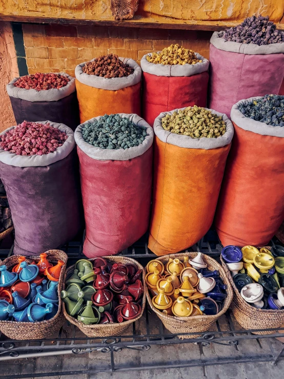 the large bundle of bags are being sold at a market