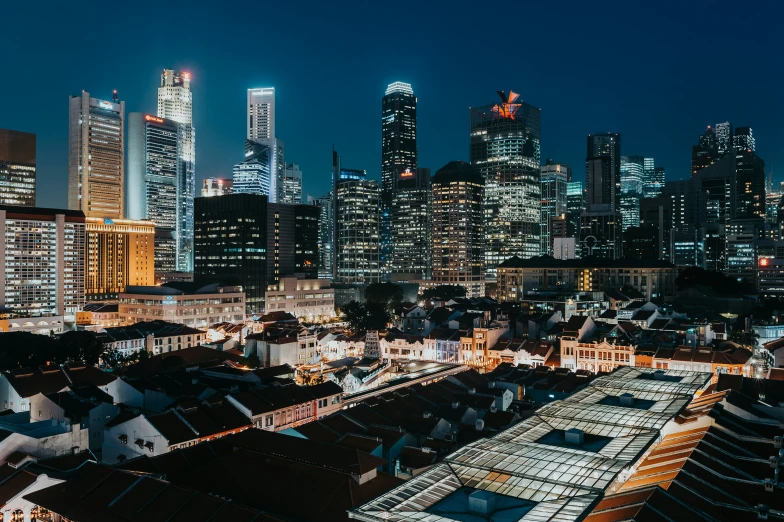 night time view of a city from top of rooftops