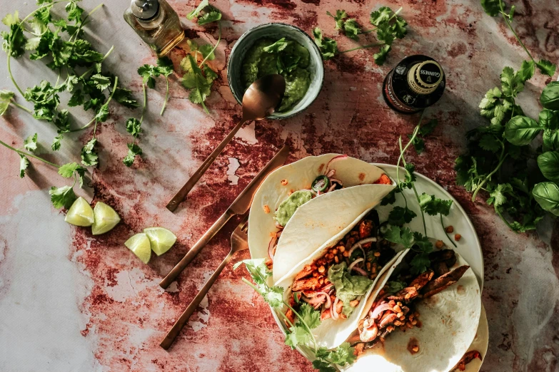 two tacos that are sitting on a plate