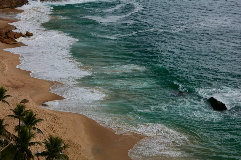 this view shows some waves and the beach