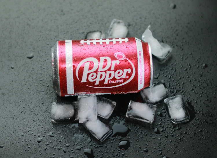 an image of a can of pepper soda on ice