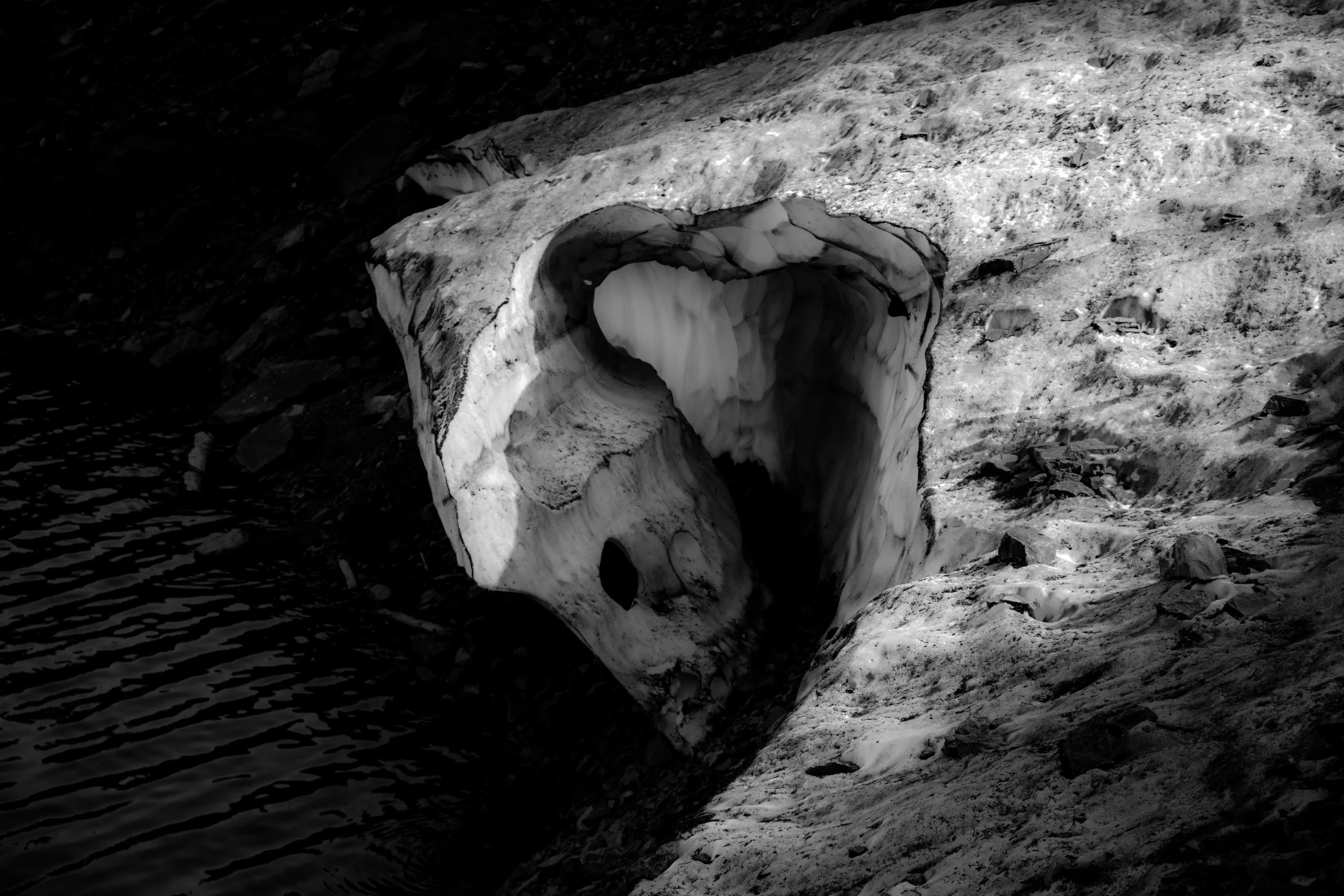 a rock formation has been made into a cave